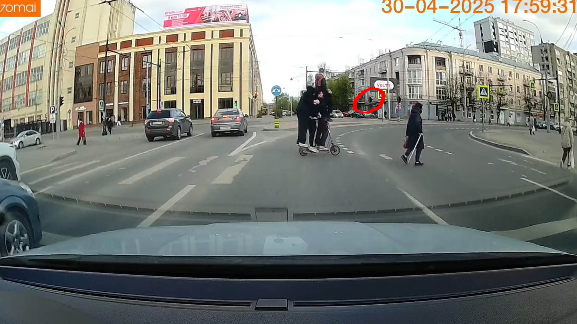 STUNT RIDERS - Four Riders Zoom Over Faded Zebra Crossing On Single Scooter - Article cover image