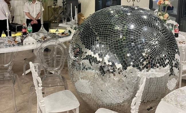 WEDDING CRASHER - Huge Disco Ball Falls On Bride At Wedding - Article cover image