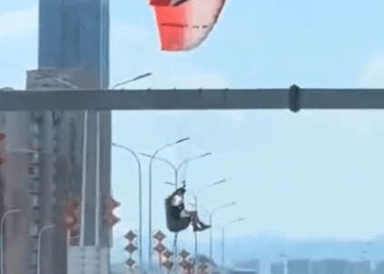 BRIDGE TOO FAR - Woman Paraglider Lands On Busy Motorway Crossing - Article cover image