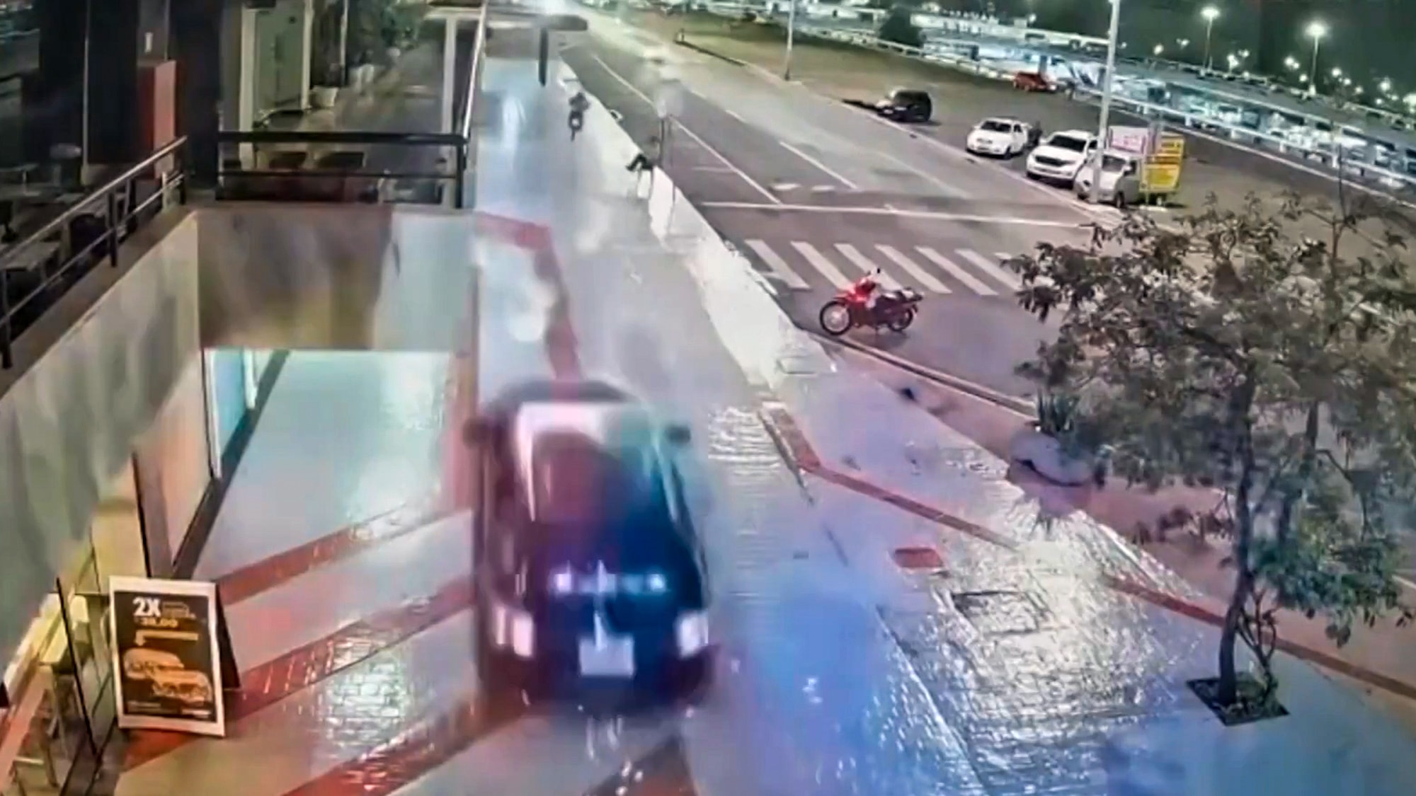 PEDESTRIANS NARROWLY MISSED - Police Car Mounts Pavement In High-Speed Chase Of Biker - Article cover image