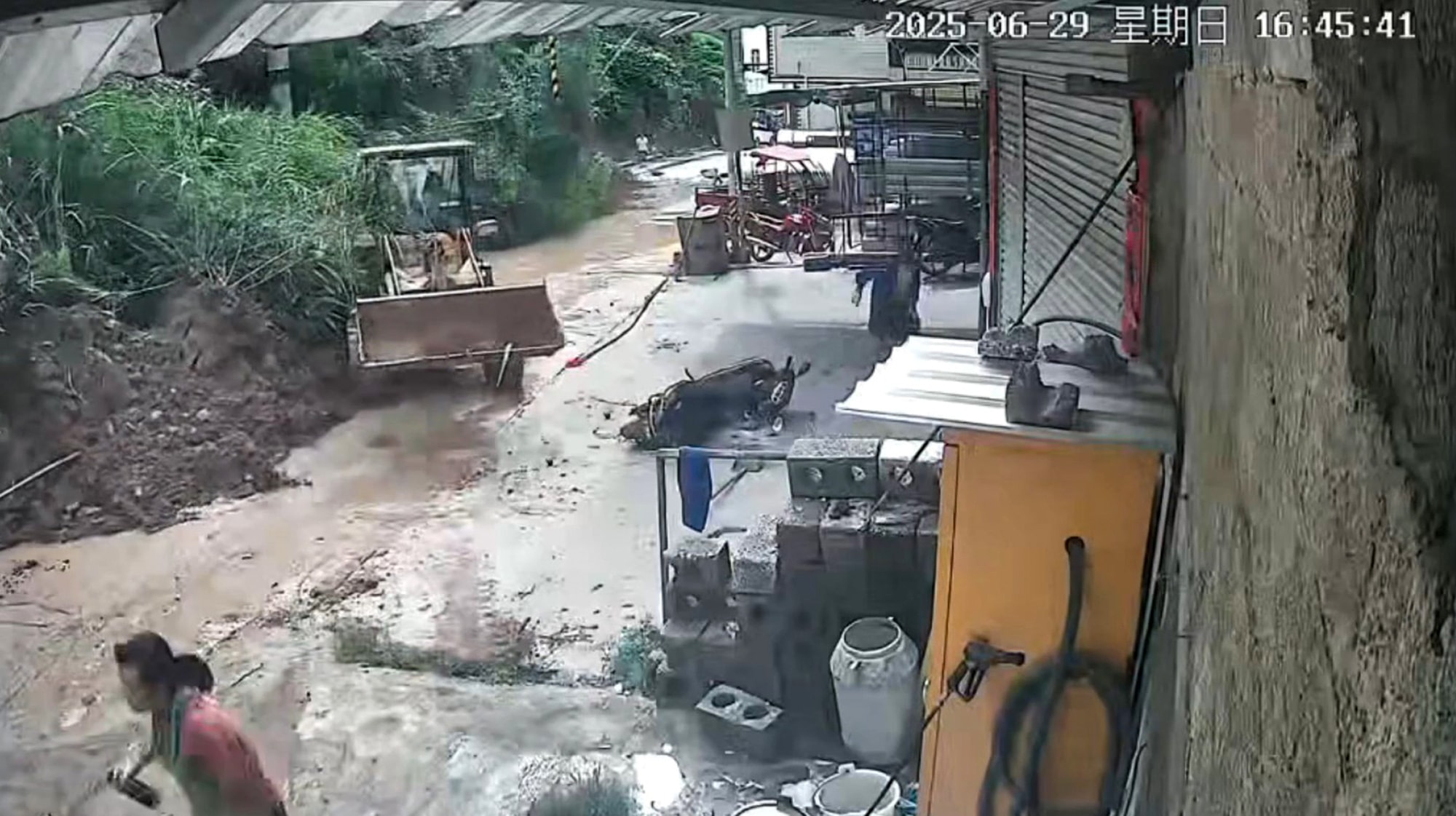 SLIPPED AWAY - Family Escapes Massive Landslide At Last Second As It Crushes Digger Against Their Home - Article cover image