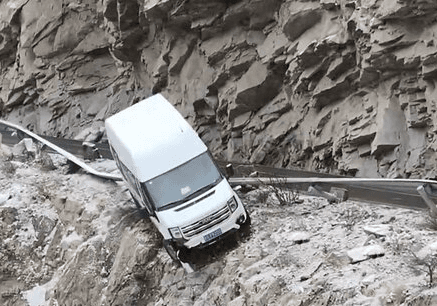 Van Hangs Over Cliff After Smashing Through Guardrail On Snowy Mountain Road