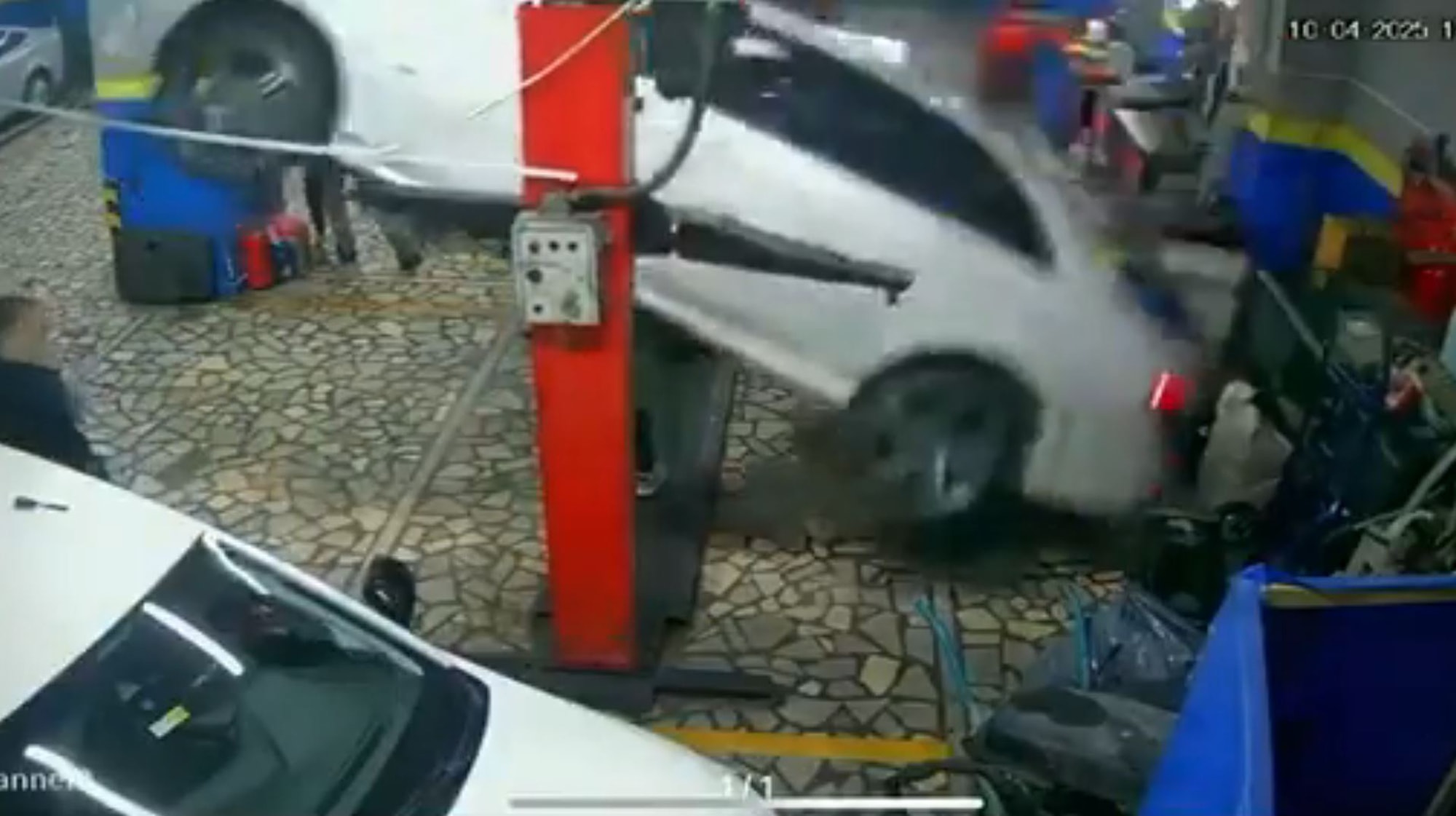 CAR CRUSH - Vehicle Falls On Top Of Mechanic In Garage - Article cover image