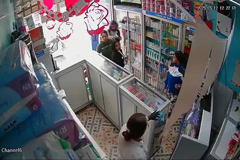 HIT MAN - Woman Gunned Down In Pharmacy By Hooded Attacker - Article cover image