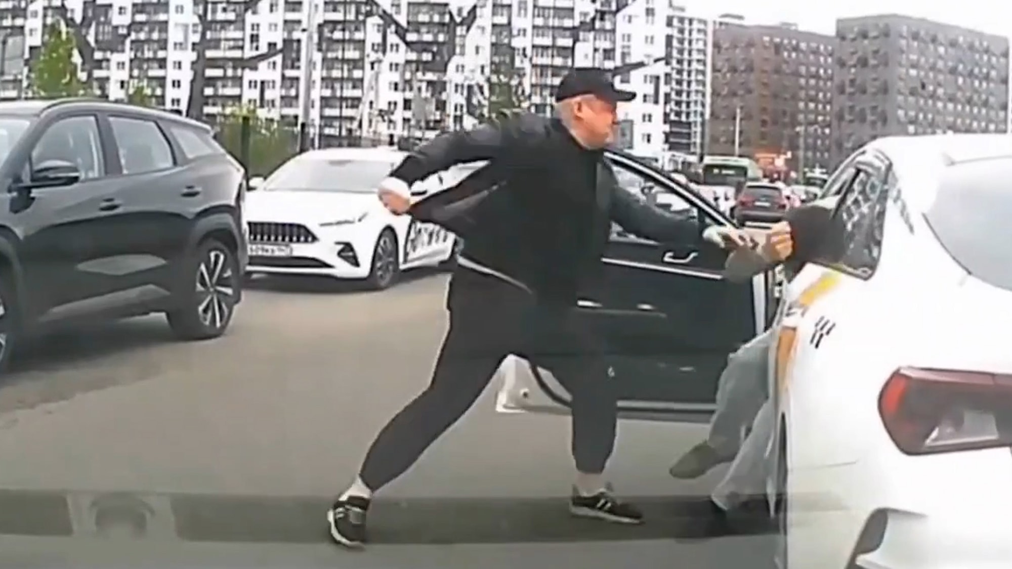 ROAD RAGE - Taxi Driver Beaten In Lane Dispute As Sandwich Munching Woman Joins In - Article cover image