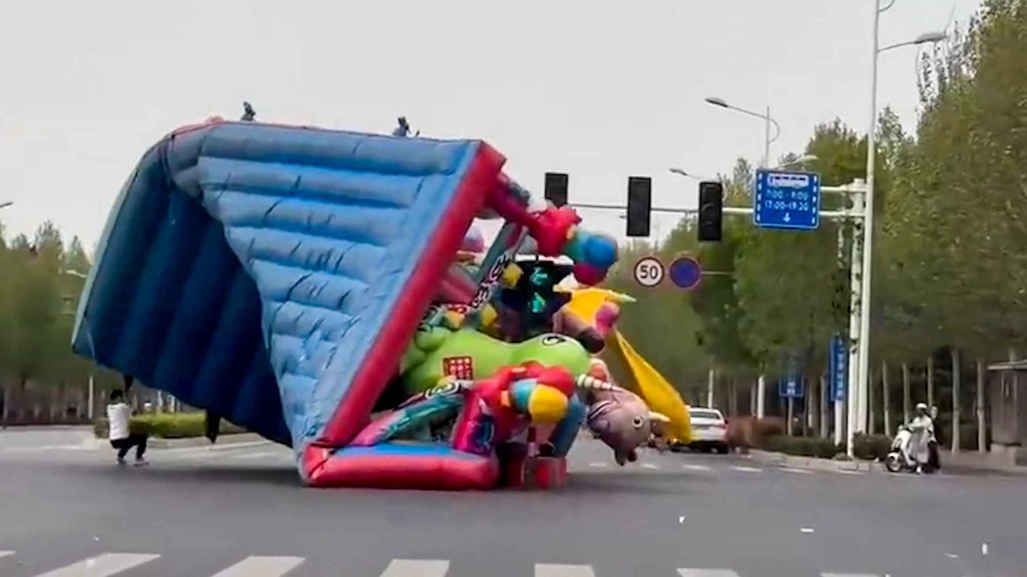 GETTING THE WIND UP: Man Dragged Down Highway By Escaped Bouncy Castle - Article cover image